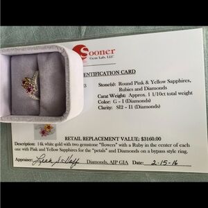 Round pink, yellow sapphire rubies and diamond flower ring.